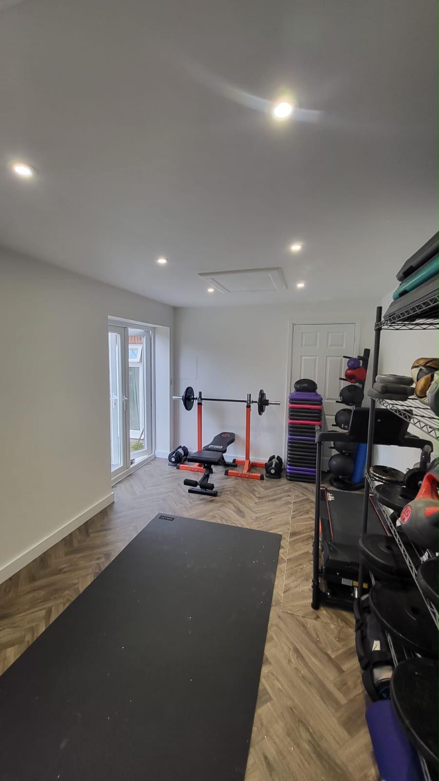 Home gym with a weights bench and exercise equipment